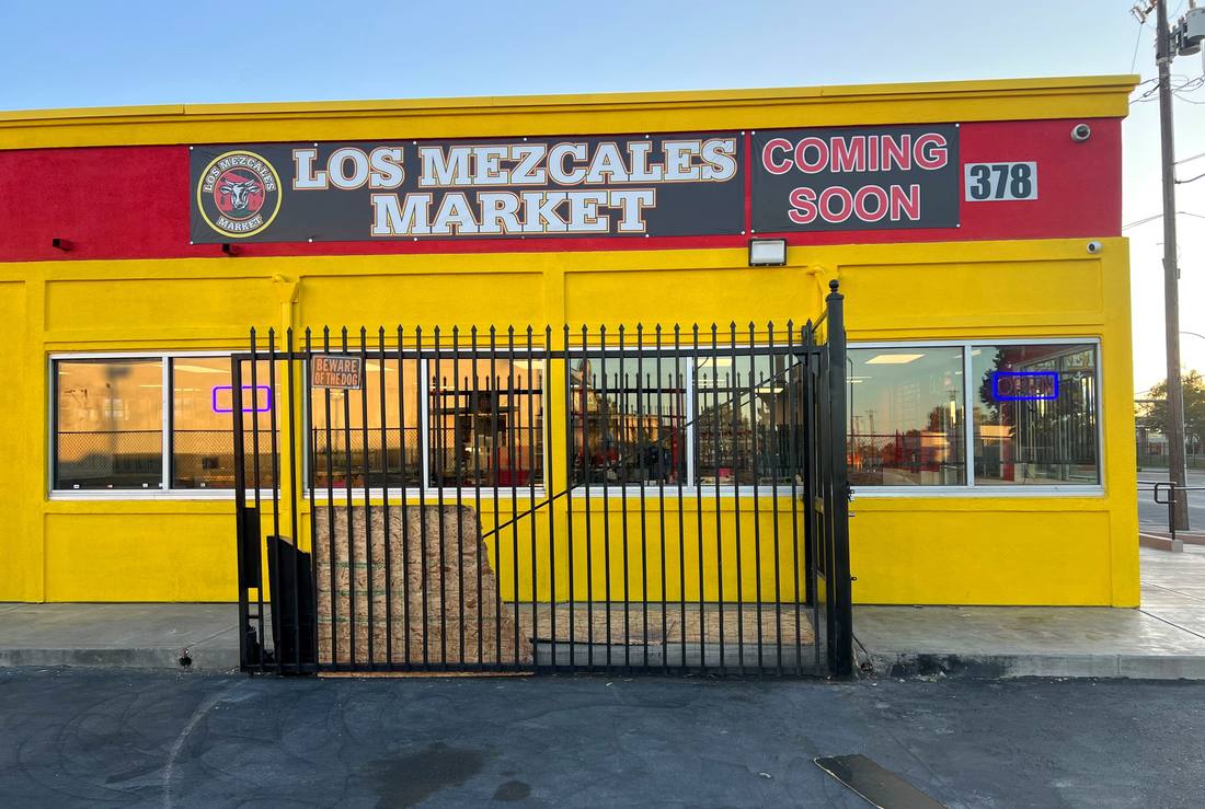 Los Mezcales Market large-format facade banner