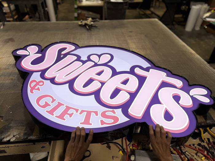 Sweets & Gifts illuminated sign in fabrication